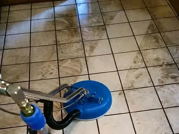 Truck-mounted steam cleaning a tile and grout kitchen floor in downtown Las Vegas