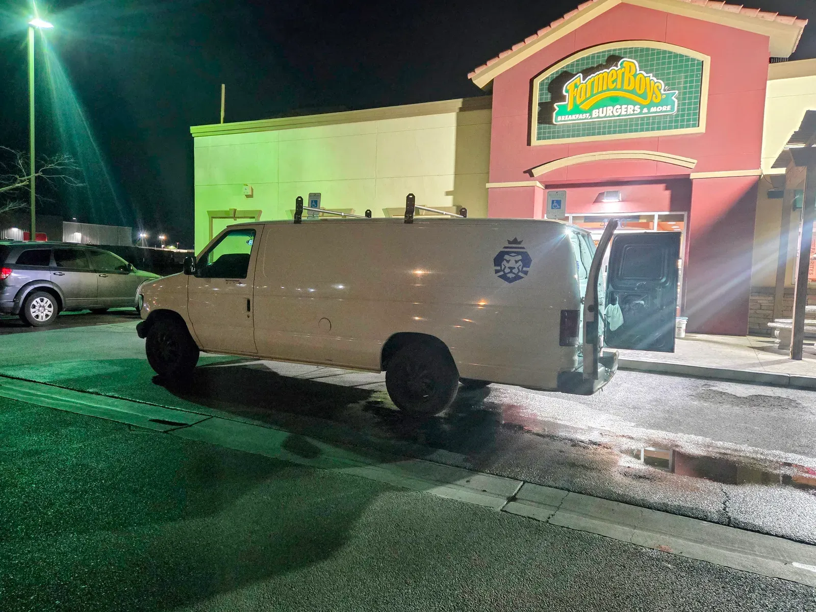 Royal Surface Restore van with rear doors open at a Las Vegas restaurant during an overnight commercial cleaning visit