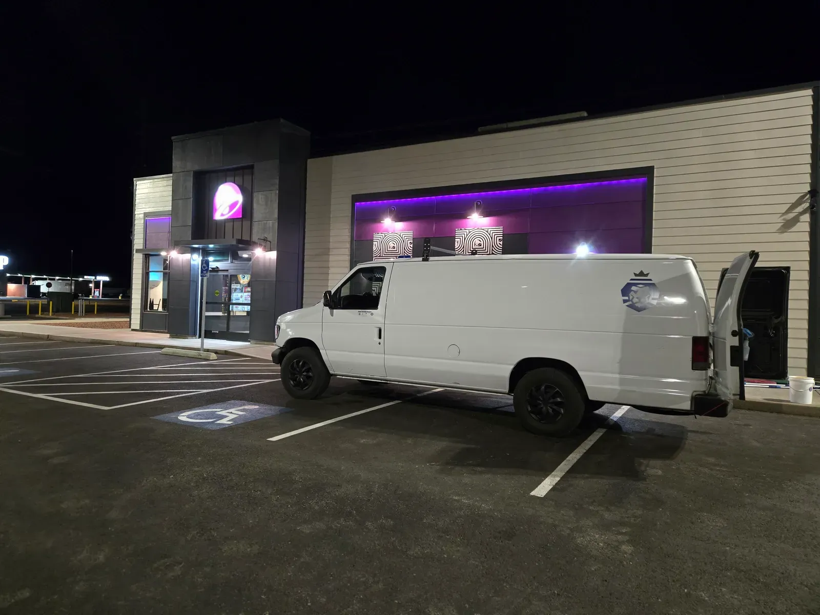 Royal Surface Restore van parked at a Las Vegas restaurant at night for an overnight commercial tile cleaning job