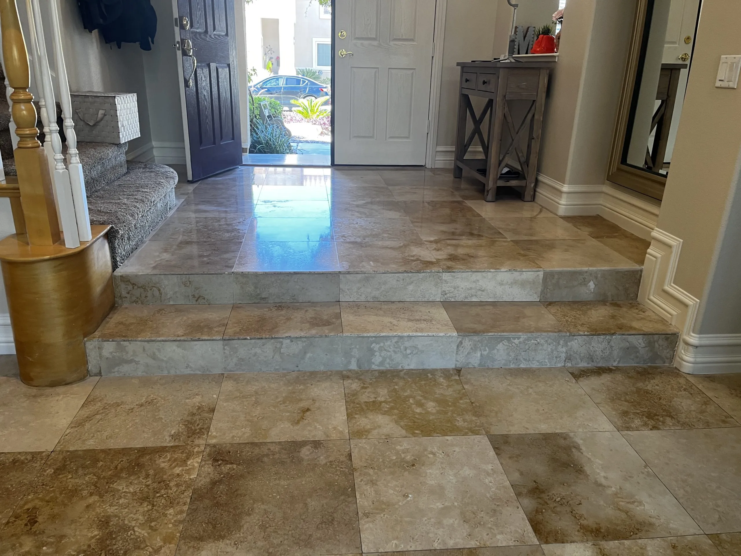 Restored travertine foyer with steps and front entry in a Las Vegas home