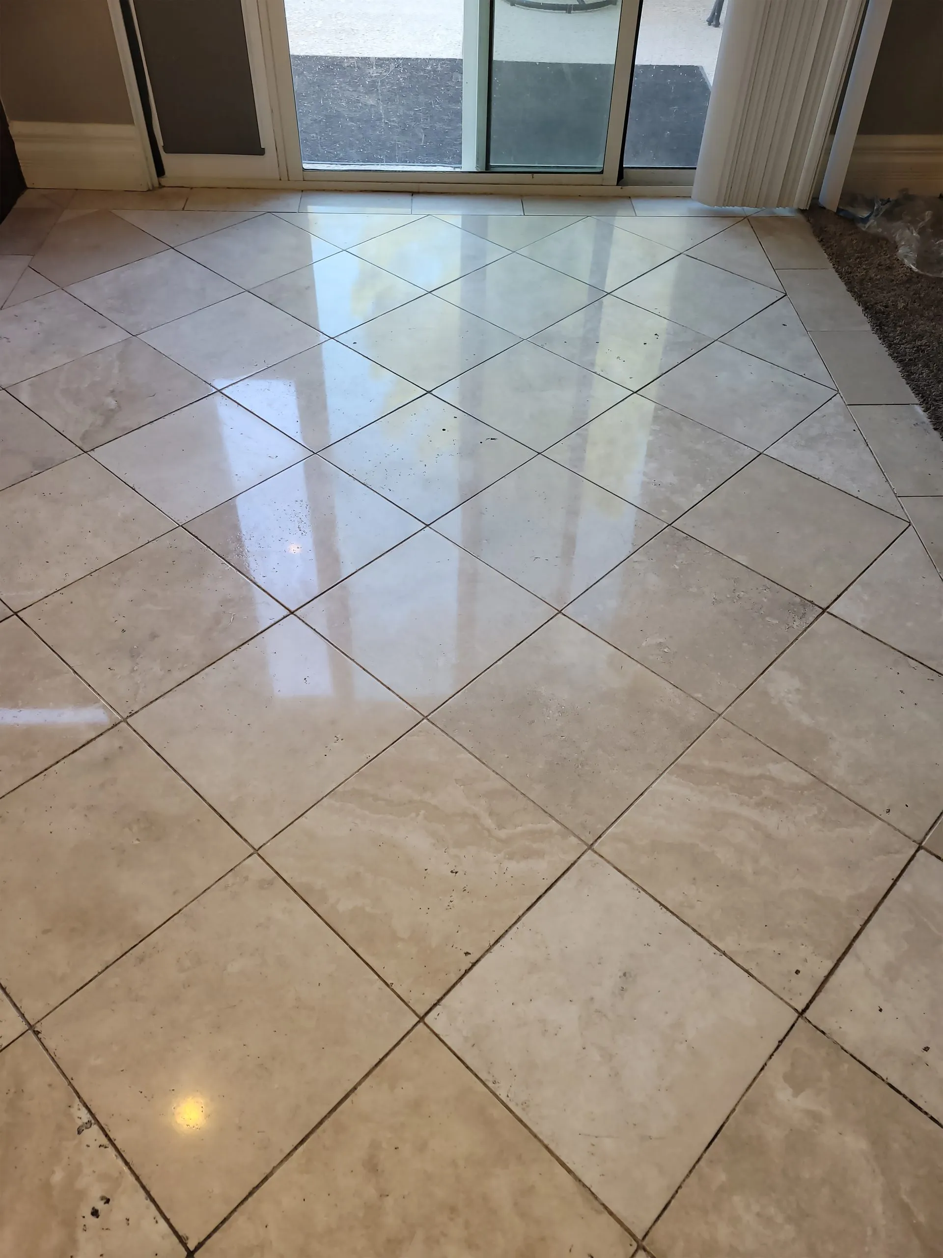 Polished travertine entryway with diamond pattern layout in a Las Vegas home