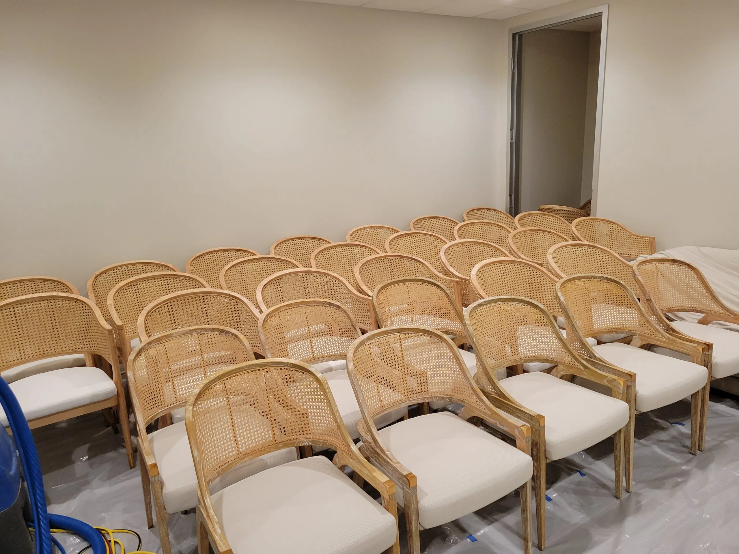 Caned commercial chairs after professional upholstery cleaning in a Las Vegas office